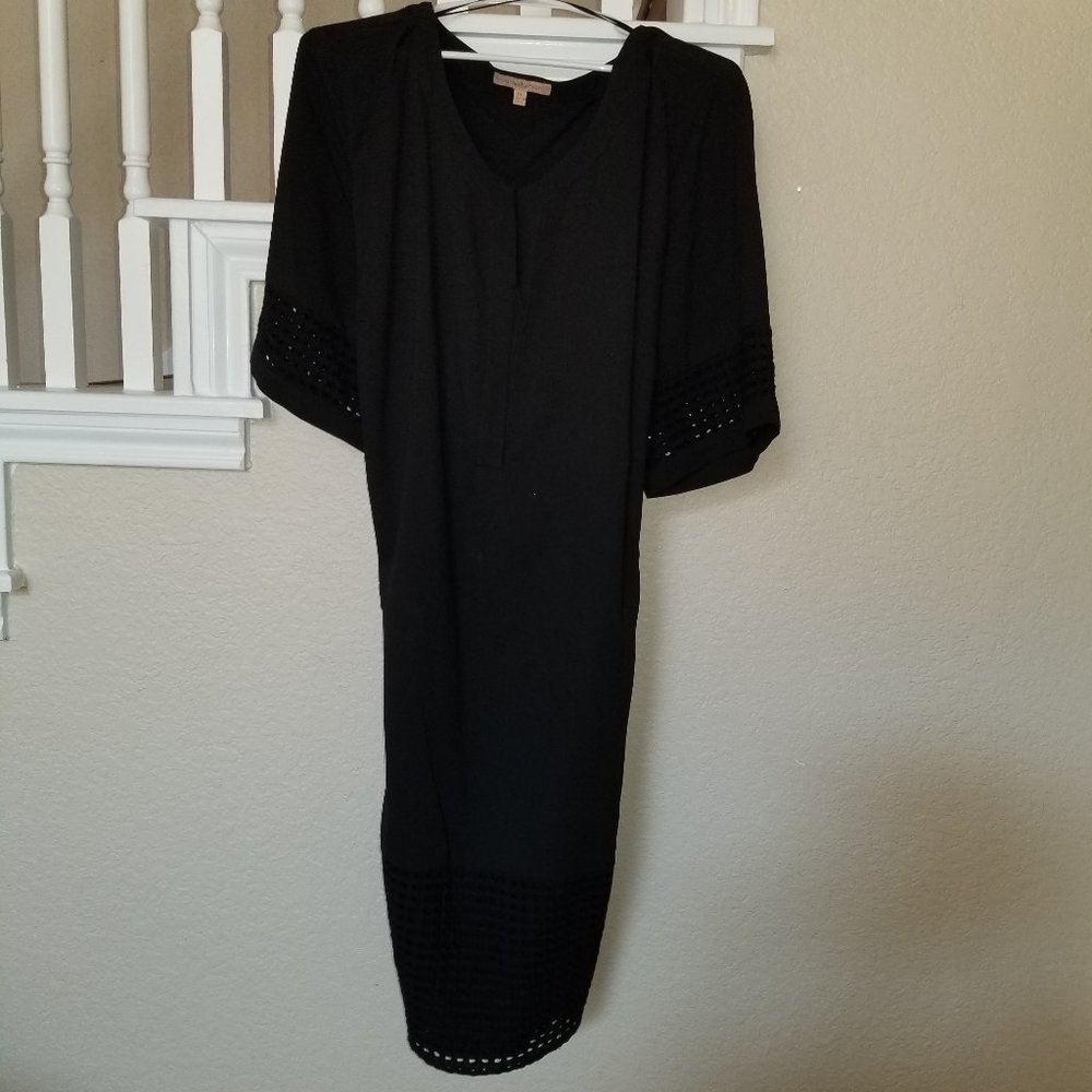 Black shift with‎ cut-out detail on sleeves, hem